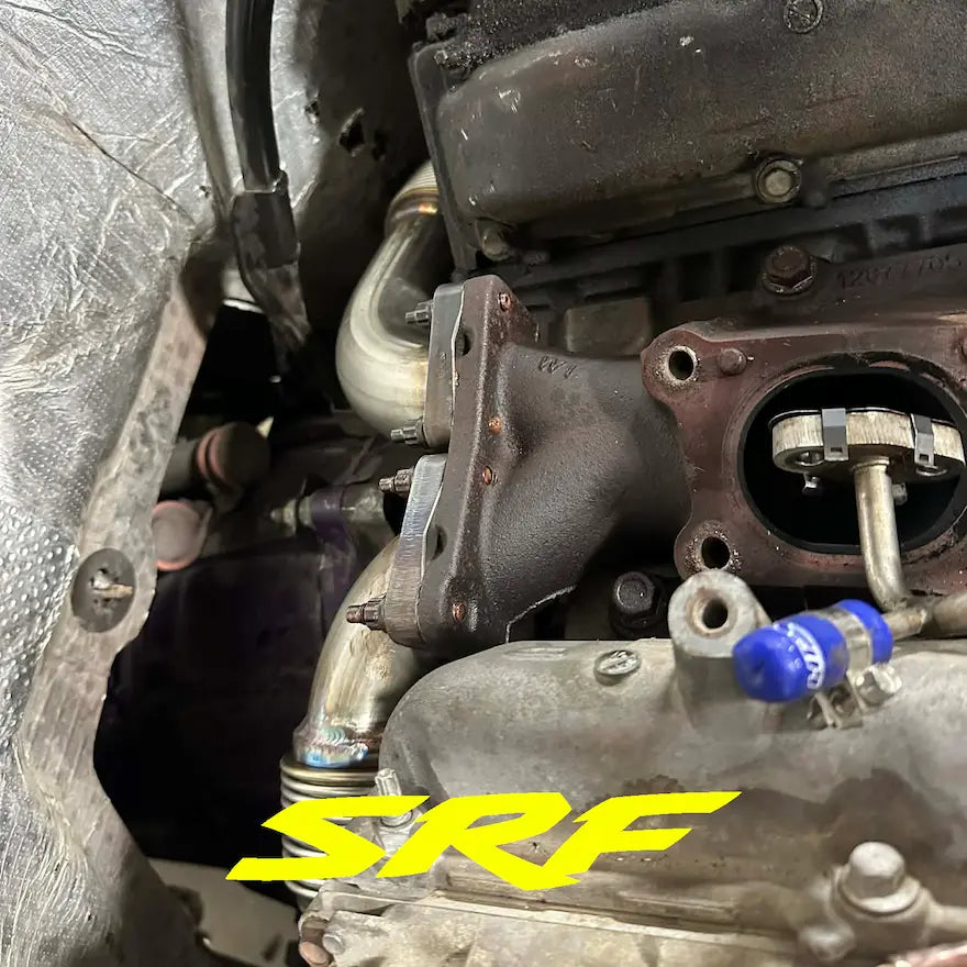 L5P Duramax engine showing new stainless up pipe and SRF S220 up pipe studs mounted