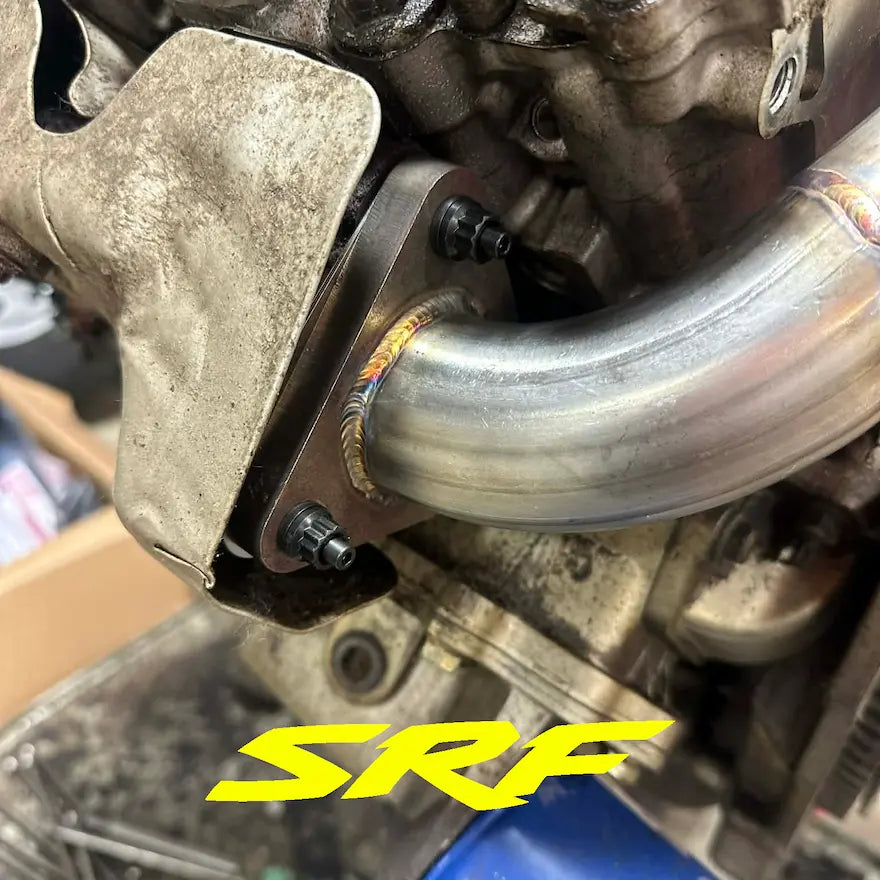 L5P Duramax engine showing new stainless up pipe and SRF S220 up pipe studs mounted
